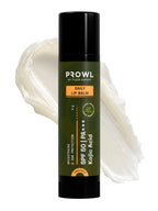 PROWL Daily Lip Balm tube standing upright in front of a thick, textured smear of clear lip balm.